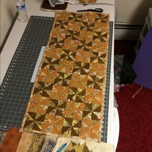 Handmade pinwheel quilted table runner